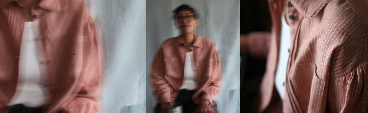 A collage of three photos of a model who is mixed race wearing a terracotta coloured linen shirt. Some of the photos are intentionally blurry so it looks a bit like a painting.